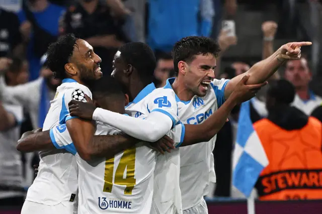Marseille players celebrate a goal