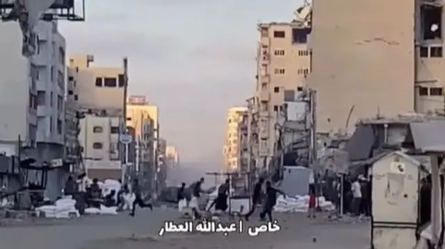 Screengrab of a video showing people running for shelter in Gaza City