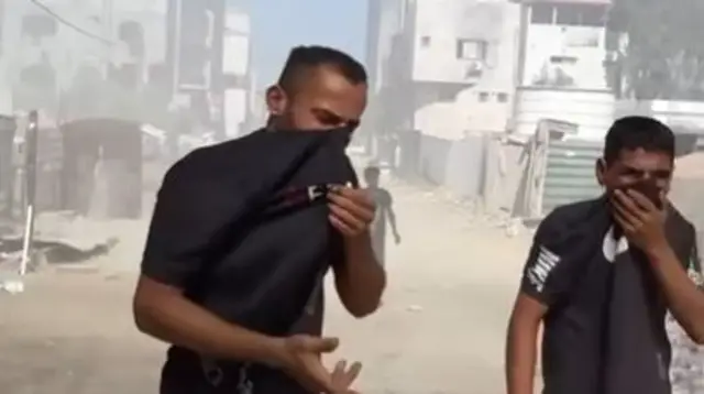 Some views in the video allowed us to see enough of the south side of Al Shifa Hospital (right of street)
