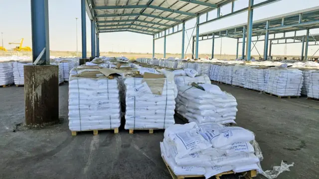 Stacks of white packages can be seen