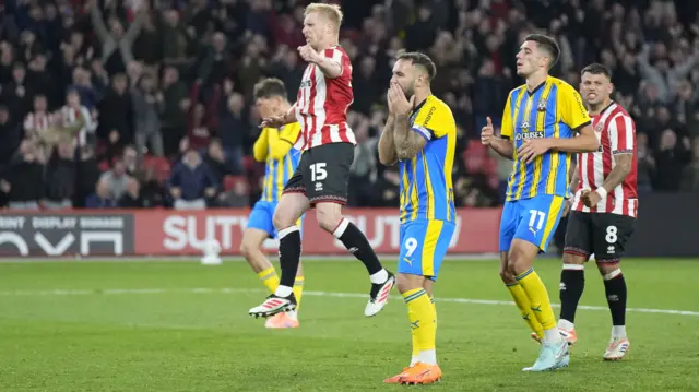 Southampton's Adam Armstrong has his head in his hands after his missed penalty