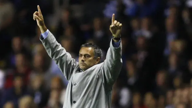 Former Chelsea manager Jose Mourinho points to the sky in celebration