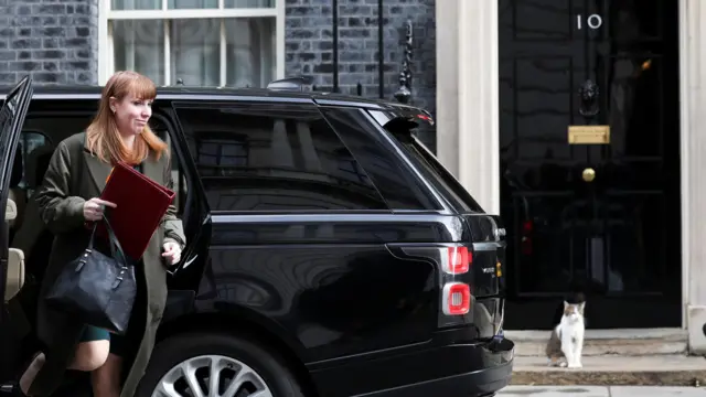Rayner steps out of a car outside No 10