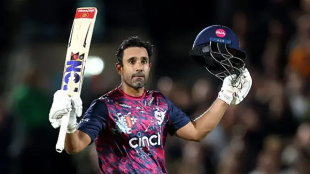 Ravi Bopara asknowledges the crowd after scoring a century for Northants against Surrey