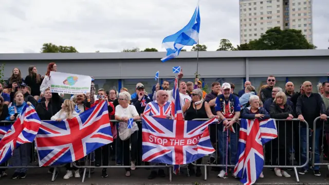 Protesters with union flags and saltires