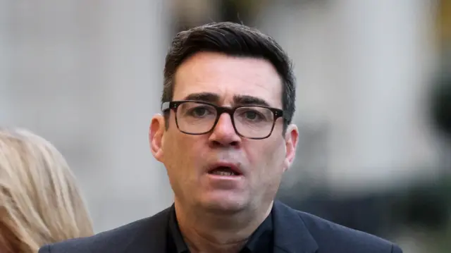 A headshot of Andy Burnham who looks ahead