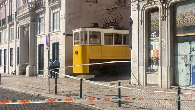 A police cordon is in place near the scene of the crash