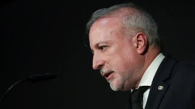 Pedro de Brito Bogas speaks at a lectern