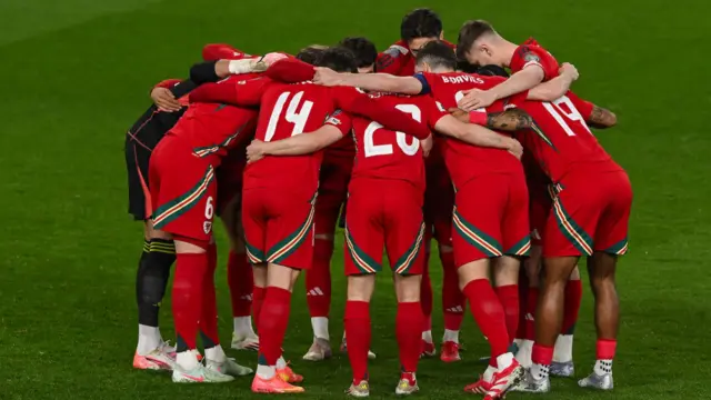 Wales players in a huddle pre-Kazakhstan home game