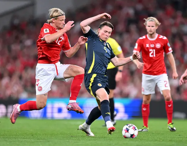 Scott McTominay and Kasper Dolberg in action
