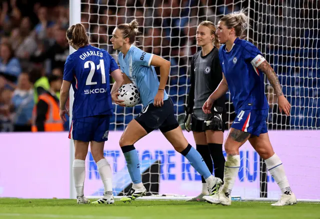 Vivianne Miedema of Manchester City collects the ball after her team's first goal, an own goal scored by Niamh Charles of Chelsea (L) during the Barclays Women's Super League match between Chelsea FC and Manchester City at Stamford Bridge on September 05, 2025 in London, England.