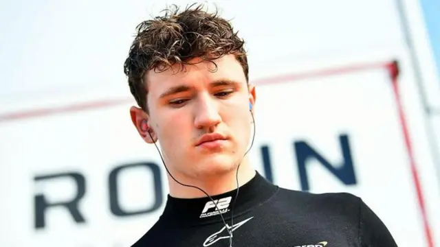 Alex Dunne looks on