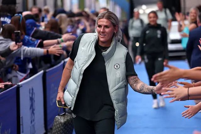 Millie Bright arrives.