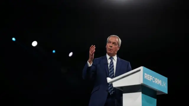 Nigel Farage speaking at Reform party conference
