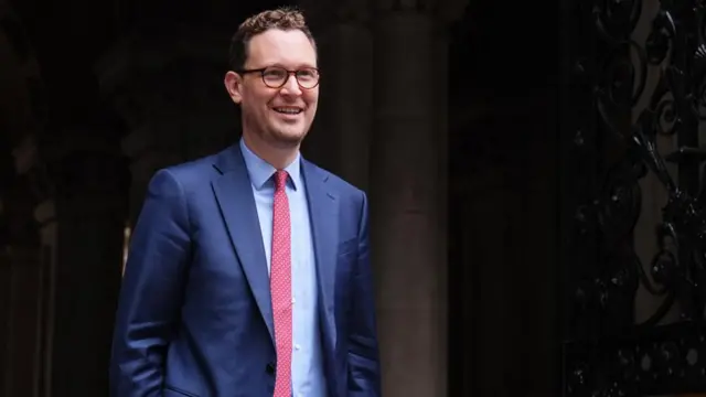 Darren Jones in a blue suit smiling