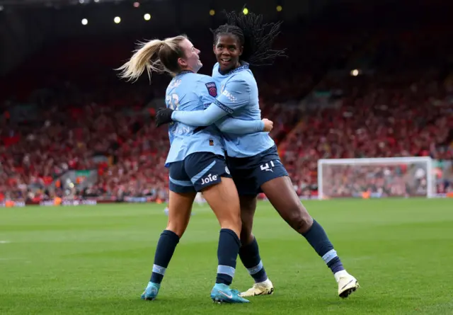 Lauren Hemp and Bunny Shaw celebrate the latter's late goal at Anfield