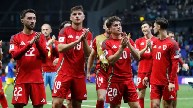 Wales players applaud travelling fans