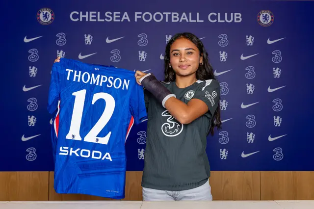 Alyssa Thompson poses with her new Chelsea number 12 shirt