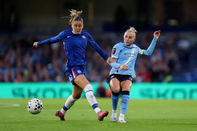Wieke Kaptein of Chelsea is put under pressure by Alex Greenwood of Manchester City during the Barclays Women's Super League match between Chelsea FC and Manchester City at Stamford Bridge on September 05, 2025 in London, England.