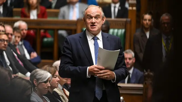 Ed davey stands in parliament