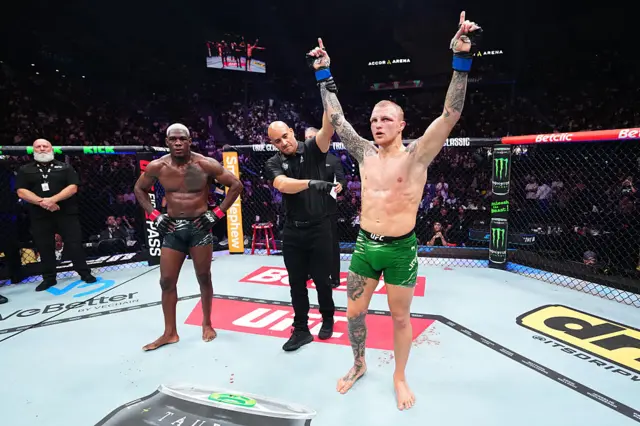 Mason Jones has his hand raised by the referee