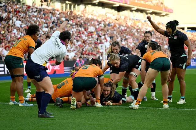 Sarah Bern scoring a try