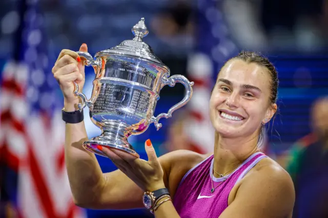 Aryna Sabalenka stands with US Open trophy after beating Jessica Pegula in 2024 final at Flushing Meadows