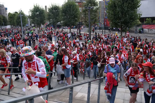 Arsenal fans support their team.