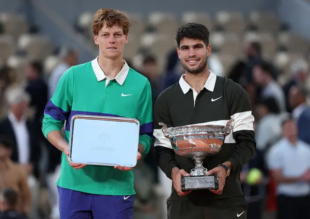 Jannik Sinner and Carlos Alcaraz with their respective trophies at the French Open final