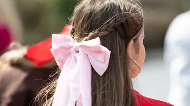 young wales fan with pink bow in hair