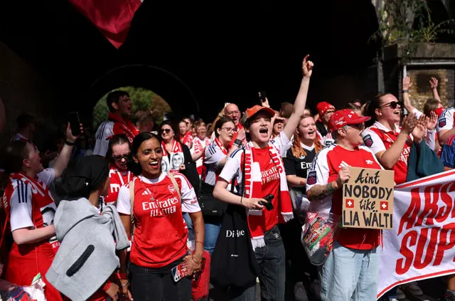 Arsenal fans support their team.