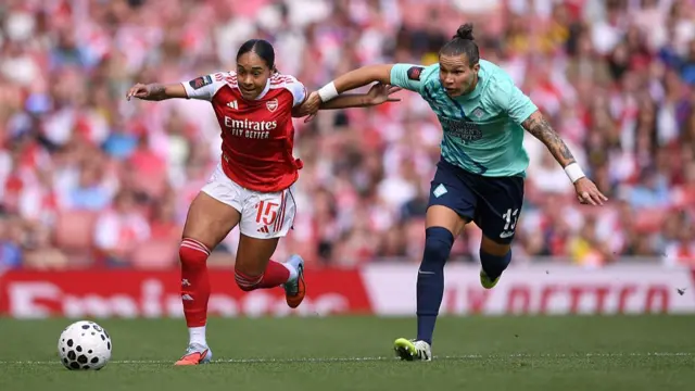 Olivia Smith of Arsenal is challenged by Elena Linari of London City Lionesses during the Barclays Women's Super League match between Arsenal and London City Lionesses at Emirates Stadium