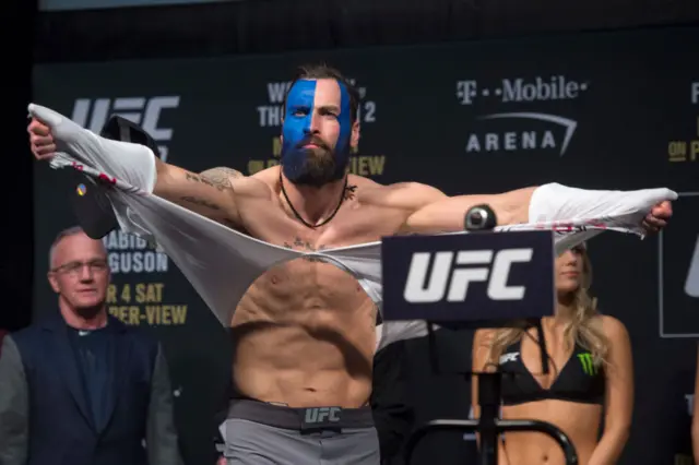 Paul Craig rips off his shirt