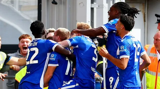 Luke Thomas celebrates scoring