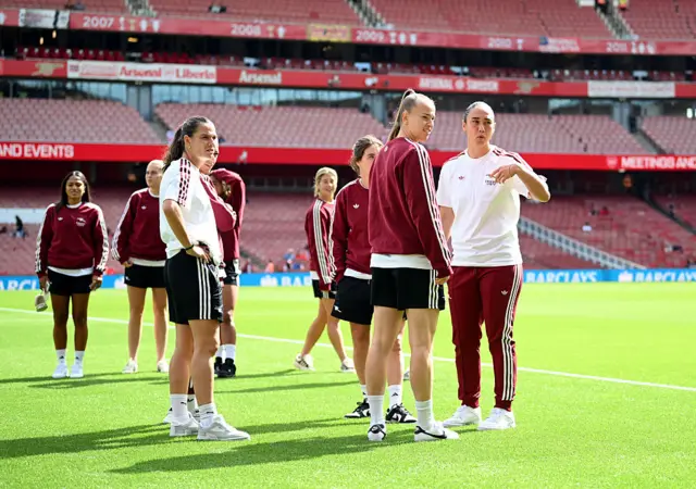 Arsenal arrive on the pitch.