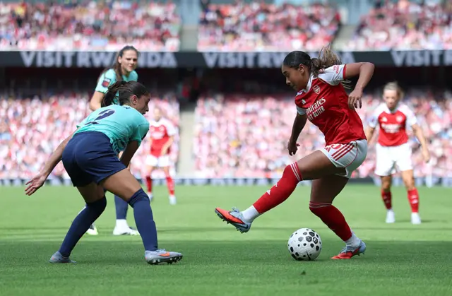 Olivia Smith of Arsenal is challenged by Jana Fernandez of London City Lionesses