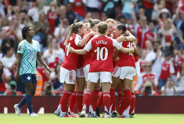 Arsenal's Olivia Smith celebrates scoring their first goal with teammate