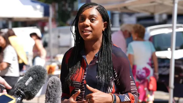 Kemi Badenoch speaks to reporters.