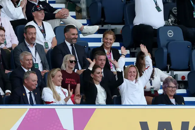 Jonathan Webb, Vice-Chair of the Executive Board of World Rugby, Zoe Aldcroft of England Catherine, Princess of Wales, Marlie Packer and Deborah Griffin OBE, President of the Rugby Football Union (RFU) participate in a Mexican wave