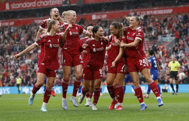 Liverpool's Cornelia Kapocs celebrates scoring their first goal with teammates