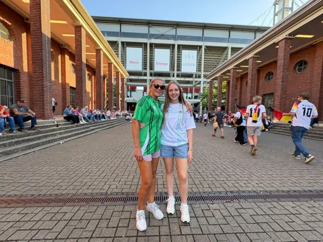 Fans enjoying the sun outside the stadium