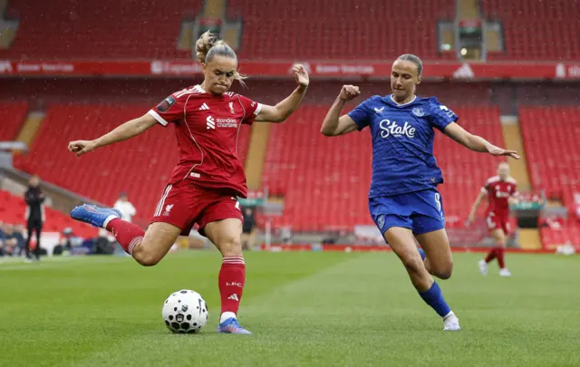 Liverpool's Samantha Kerr in action with Everton's Rosa van Gool