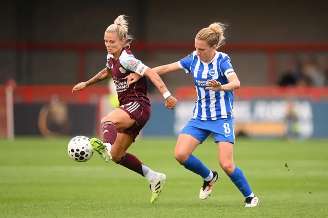 Rachel Daly of Aston Villa controls the ball whilst under pressure from Maisie Symonds of Brighton & Hove Albion during the Barclays Women's Super League match between Brighton & Hove Albion and Aston Villa at Broadfield Stadium on September 07, 2025 in Crawley, England.