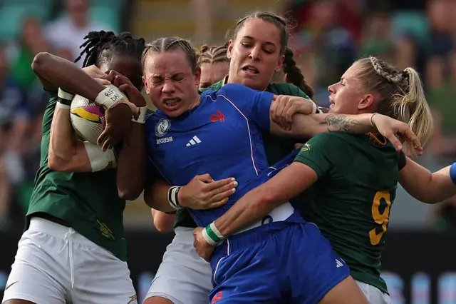 Marine Menager has the ball stripped from her hands