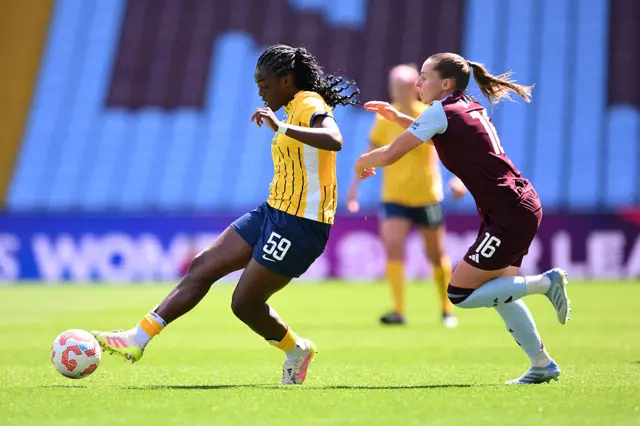 Michelle Agyemang of Brighton & Hove Albion controls the ball whilst under pressure from Noelle Maritz of Aston Villa during the Barclays Women's Super League match between Aston Villa FC and Brighton & Hove Albion FC at Villa Park on May 10, 2025 in Birmingham, England.