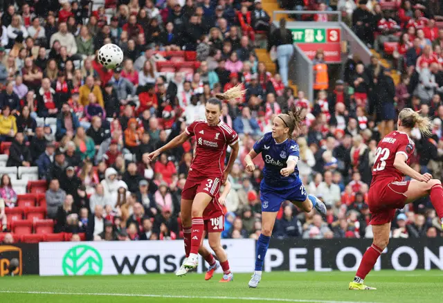 Katja Snoeijs of Everton scores her team's first goal whilst under pressure from Gemma Evans of Liverpool during the Barclays Women's Super League match between Liverpool and Everton at Anfield on September 07, 2025 in Liverpool, England.