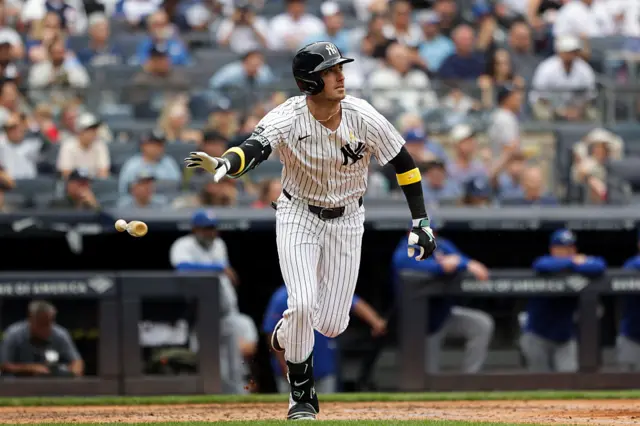 Cody Bellinger #35 of the New York Yankees throws his bat