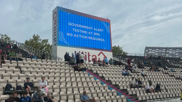 Big Screen at Southampton cricket ground saying "Government alert testing 3pm no action required"