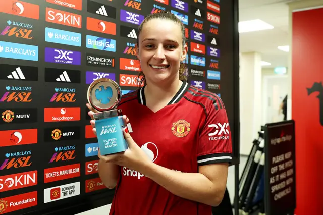 Ella Toone of Manchester United poses for a photo with the Barclays Women's Super League Player of the Match award