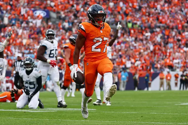 JK Dobbins celebrates after running in a touchdown for the Denver Broncos against the Tennessee Titans